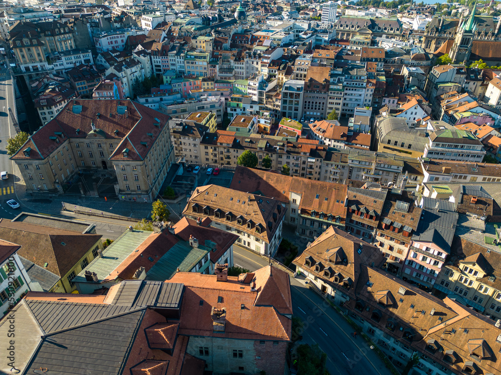 Lausanne, Switzerland, August 22nd 2022. Drone aerial view of the city centre at sunrise