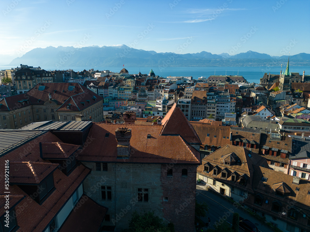 Lausanne, Switzerland, August 22nd 2022. Aerial drone shot of the city centre and lake Geneva in the background.