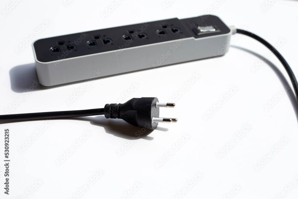 Electrical power strip and plug on white background. Electrical power strip and plug on white background.