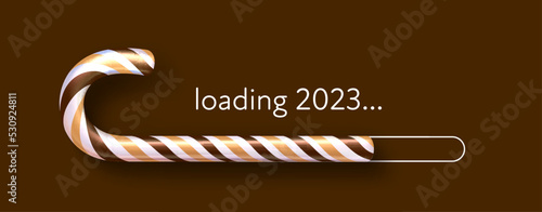 Striped brown and yellow candy cane 2023 loading bar on brown background.