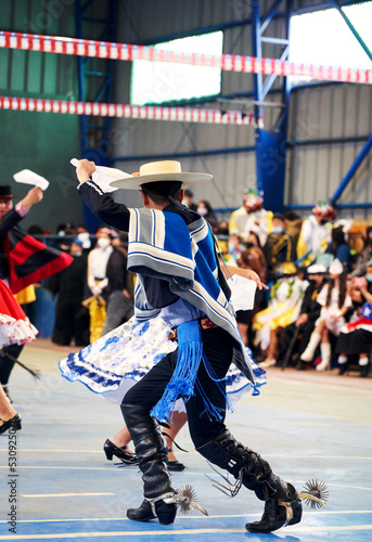 young couple dancing national dance cueca in chilean national holidays photo