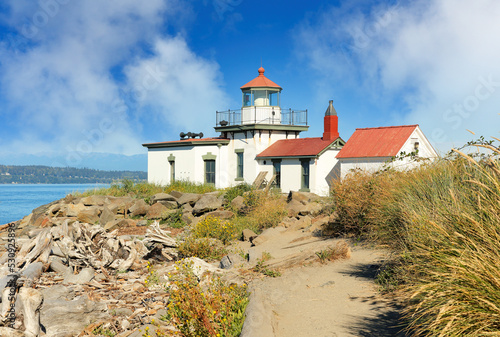 West Point Light House  also known as the Discovery Park Lighthouse on a sunny day. The lighthouse is an active aid to navigation on Seattle, Washington's West Point.