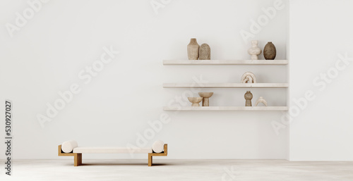 Stone open wall shelve on plastered walls, open shelves with decorative old vases, candlesticks, sculptures. Wooden daybed in Balinese style. Mock up poster frame photo