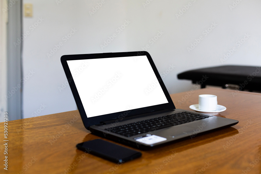 Close up view computer mockup white background on table. Laptop with blank screen at work desk. Close up view computer mockup white background on table. Laptop with blank screen at work desk.
