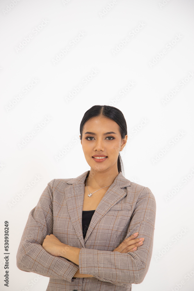 Isolated photo of a businesswoman in a suit smiling in a white background Isolated photo of a businesswoman in a suit smiling in a white background