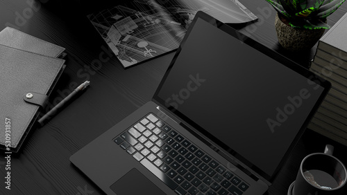 Laptop Mock-Up black color on work desk with notebook and cup coffee. Designed in dark tone. Can be used in education or business background. 3d render.