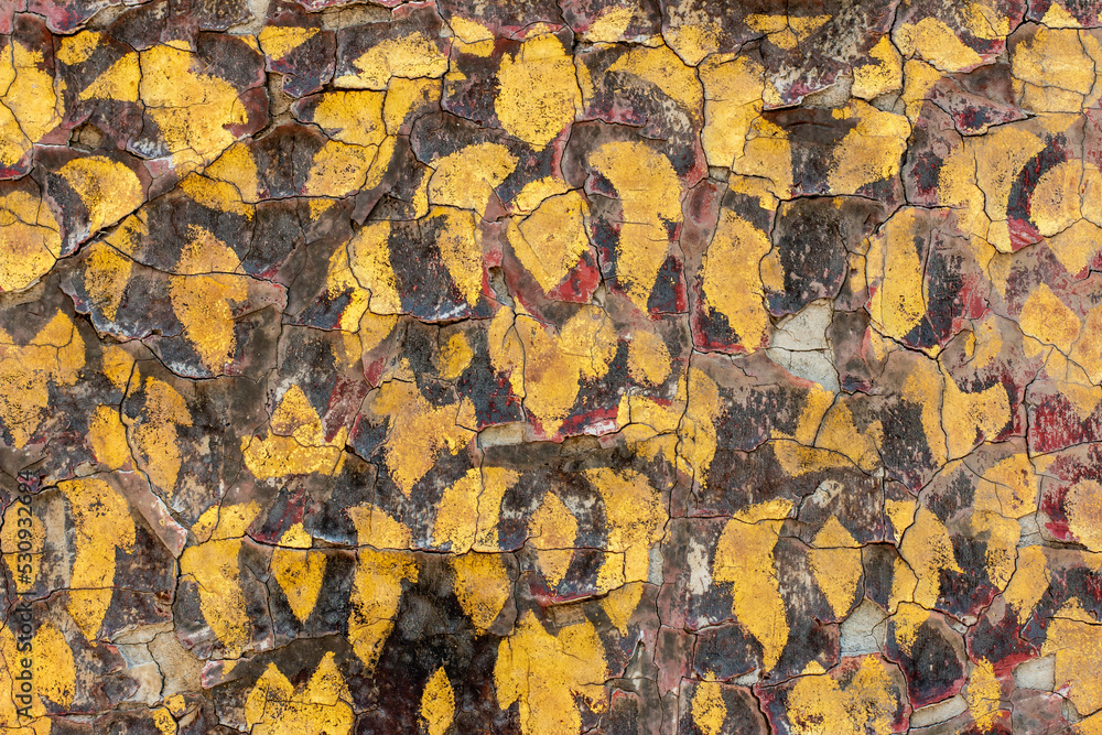 Old golden yellow Thai pattern on the temple wall