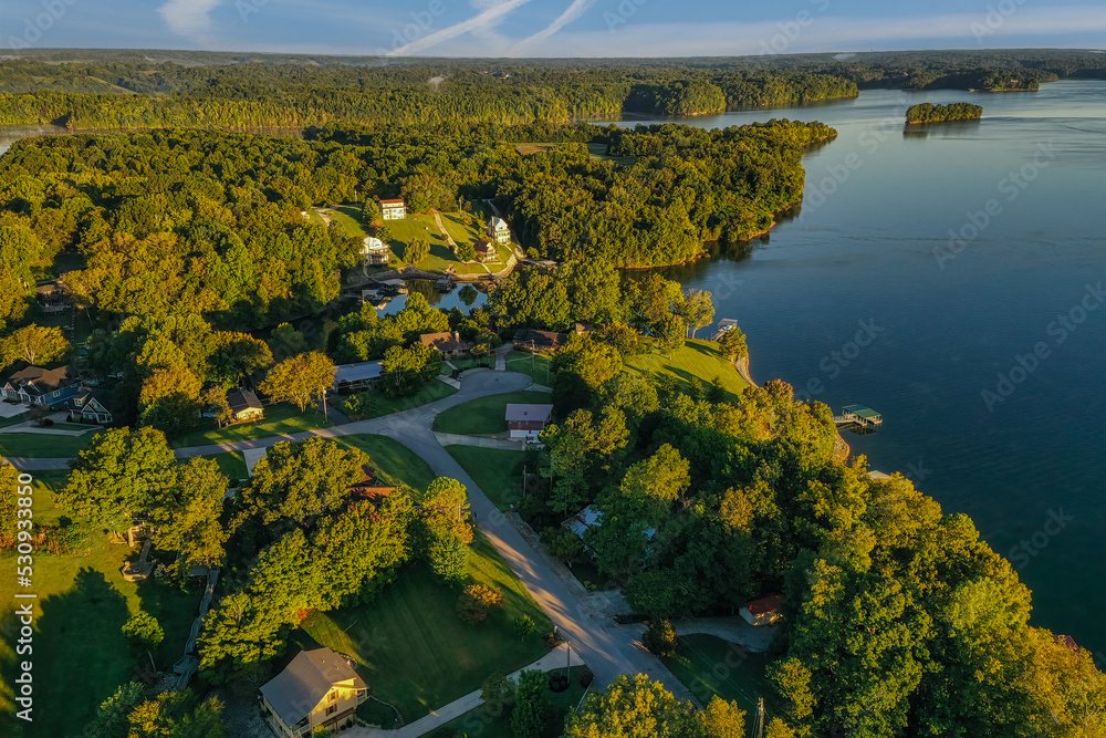 Aerial overhead view of residential, lakefront and lake view homes and