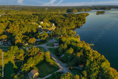 Aerial overhead view of residential, lakefront and lake view homes and floating boat docks on Tims Ford Lake in Tennessee.