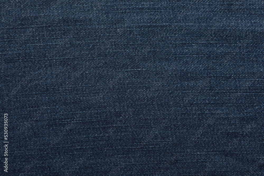 Texture of dark blue jeans as background, closeup Texture of dark blue jeans as background, closeup