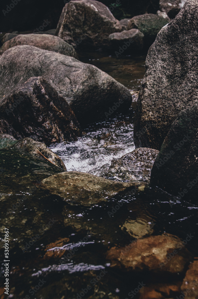 picture of a waterfall that flows fresh in the mountains and is a place of recreation for residents and tourists who come picture of a waterfall that flows fresh in the mountains and is a place of recreation for residents and tourists who come