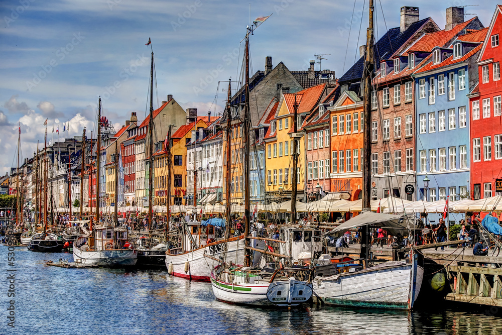 Copenhagen, Denmark - July 10, 2018: The colourful boats and buildings of the Nyhavn district of Copenhagen

