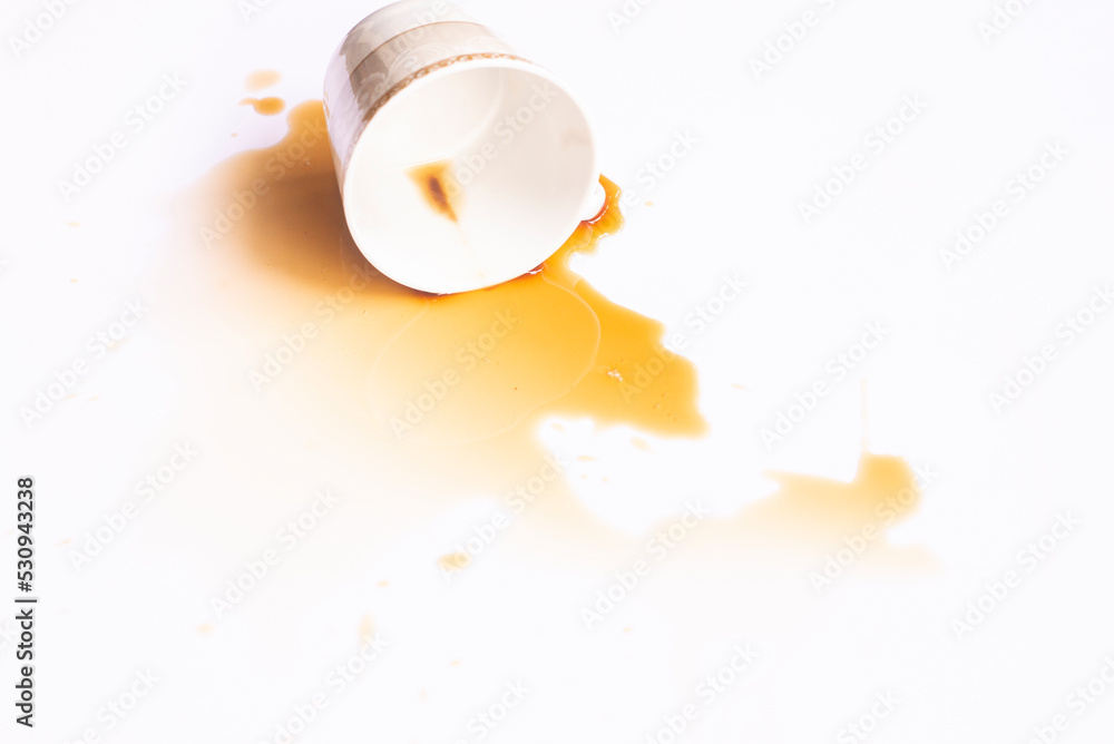 Concept image of Spilled coffee cup stain on white floor Concept image of Spilled coffee cup stain on white floor