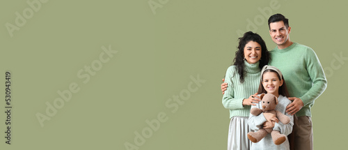 Happy family in warm sweate...