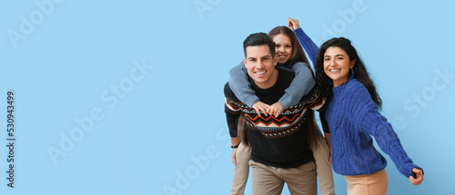 Happy family in warm sweate...