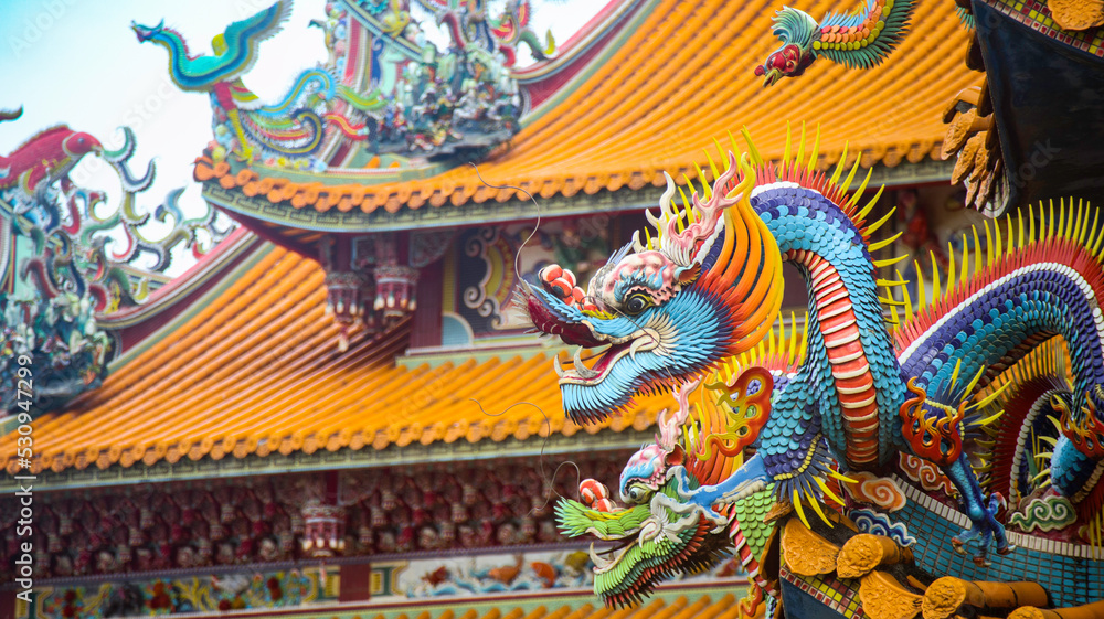 close-up of dragon sculpture on Chinese temple roof close-up of dragon sculpture on Chinese temple roof