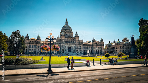 Parliament building, Victoria, BC; with inner harbor summer activities underway all around