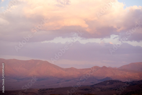 Soft evening light on the hills and clouds at sunset over D hill in Dayton Nevada