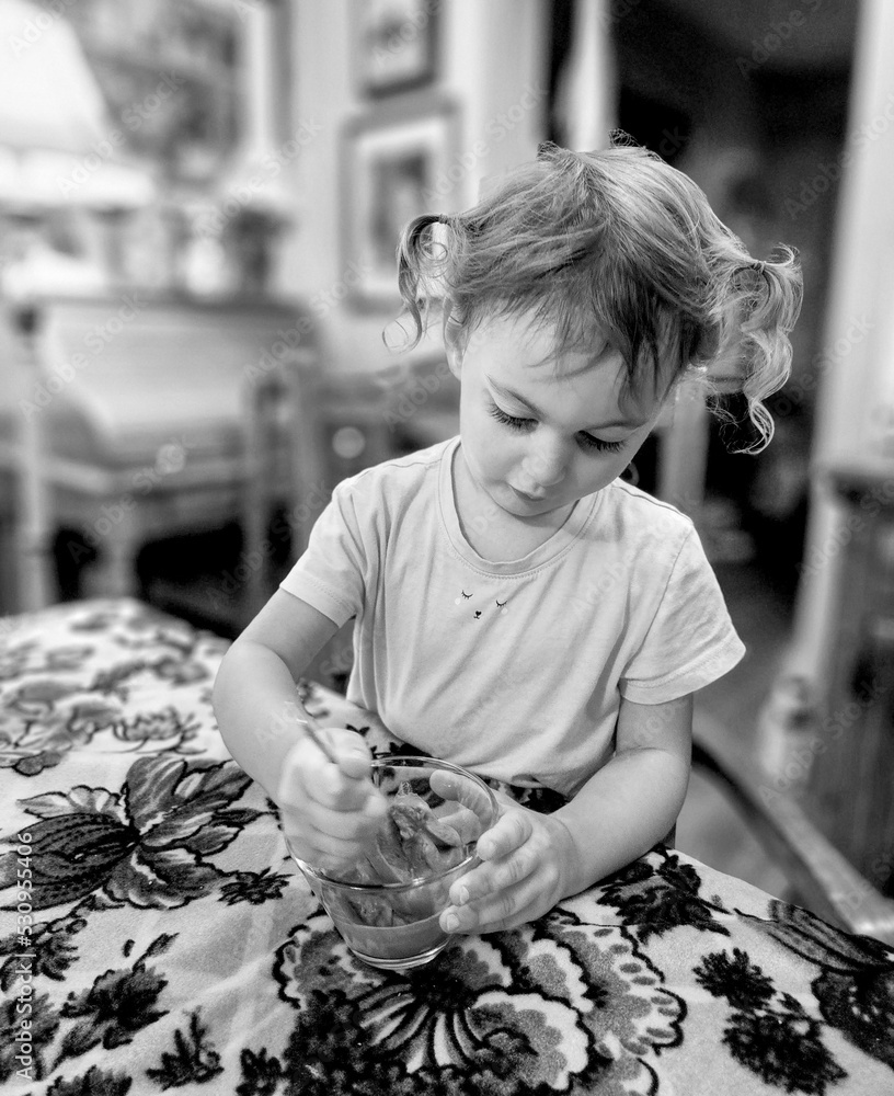 Little Girl Eating Ice Cream At A Table Stock Photo Adobe Stock Little Girl Eating Ice Cream At A Table Stock Photo Adobe Stock
