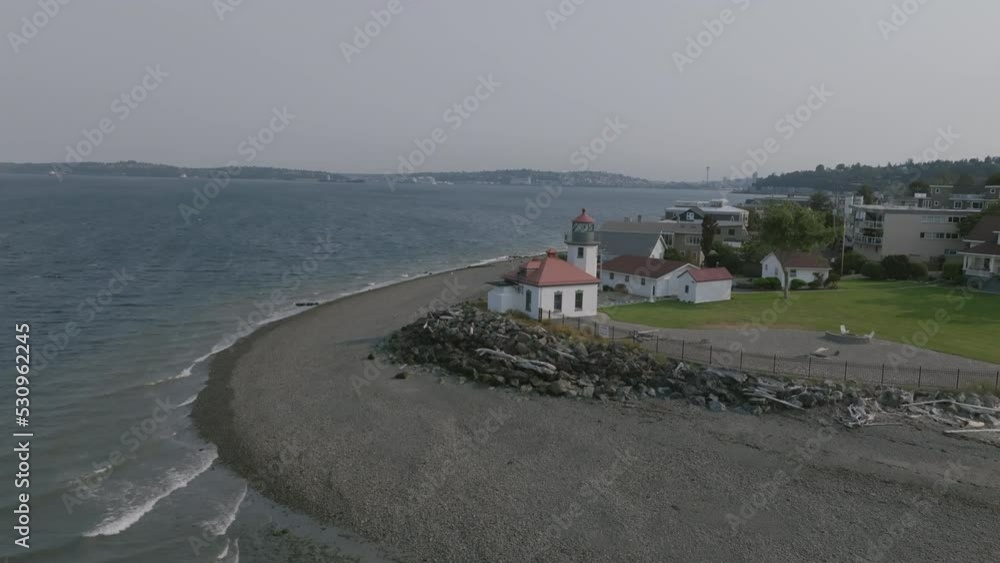 Slow aerial push towards the Alki Point Lighthouse in Seattle, Washington. Slow aerial push towards the Alki Point Lighthouse in Seattle, Washington.