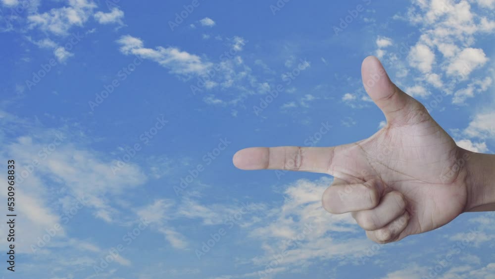 Power button flat icon on finger over blue sky with white clouds, Start up business concept Power button flat icon on finger over blue sky with white clouds, Start up business concept