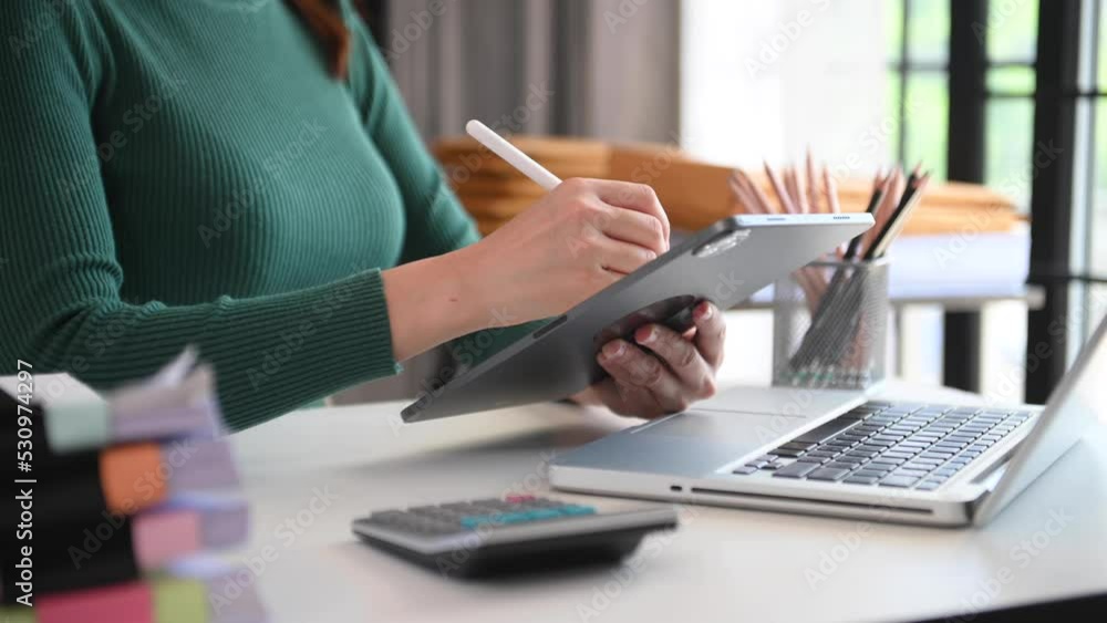 businesswoman working with digital tablet computer and smart phone with financial business strategy layer effect on desk in morning light businesswoman working with digital tablet computer and smart phone with financial business strategy layer effect on desk in morning light