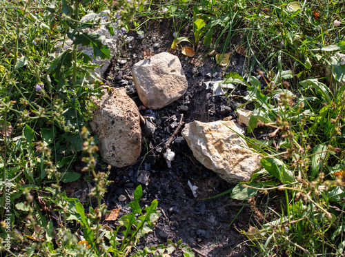 Large stones with coal after a fire