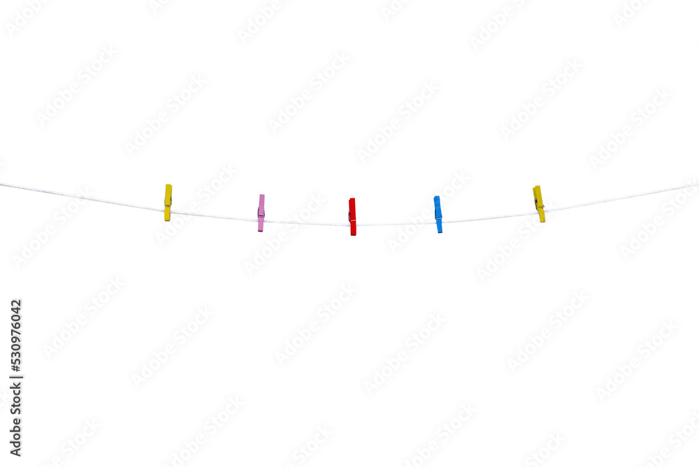 Wood cloth clip patterns (red pik blue yellow))on brown string line for hanging photo isolated on white background , clipping path Wood cloth clip patterns (red pik blue yellow))on brown string line for hanging photo isolated on white background , clipping path