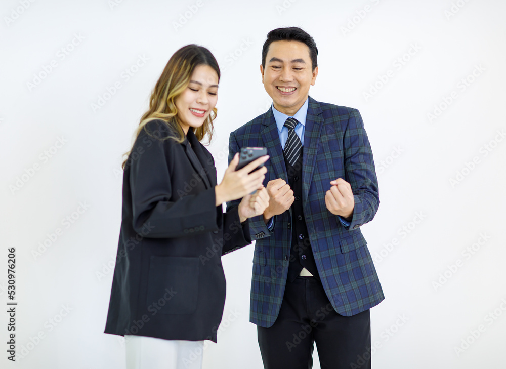 Millennial Asian cheerful successful professional male businessman manager female businesswoman colleague in formal suit standing smiling holding using laptop computer together on white background Millennial Asian cheerful successful professional male businessman manager female businesswoman colleague in formal suit standing smiling holding using laptop computer together on white background