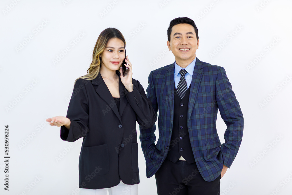 Millennial Asian cheerful successful professional male businessman manager female businesswoman colleague in formal suit standing smiling holding using laptop computer together on white background Millennial Asian cheerful successful professional male businessman manager female businesswoman colleague in formal suit standing smiling holding using laptop computer together on white background