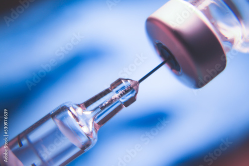 Vaccine vial dose flu shot drug needle syringe,medical concept. photo