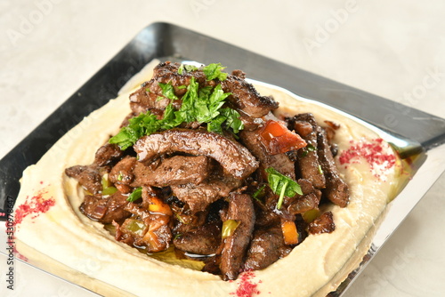 beef liver, served dry or with curry in a bowl, karahi or plate
