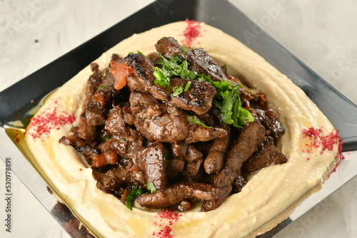 beef liver, served dry or with curry in a bowl, karahi or plate
