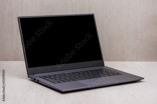 black mock up on a laptop screen on a gray background close up with clipping path photo