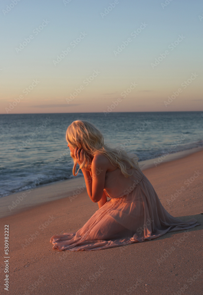 full length portrait of beautiful young woman with long hair wearing ...