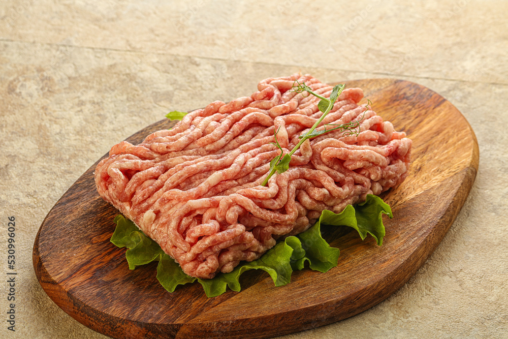 Raw minced pork meat over board Raw minced pork meat over board