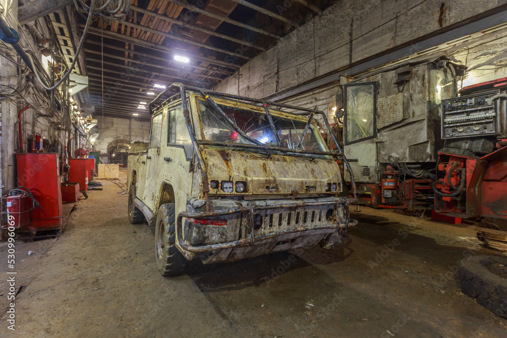 Truck for people transportation in kimberlite mine tunnel.