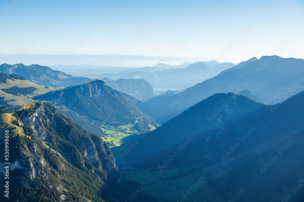 view over Diemtigtal on a summer morning with Lake Thun in the distance view over Diemtigtal on a summer morning with Lake Thun in the distance