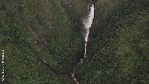 Strong Single Drop Waterfall Of Salto de Bordones In Isnos, Saladoblanco, Huila, Colombia. Aerial Drone Shot photo