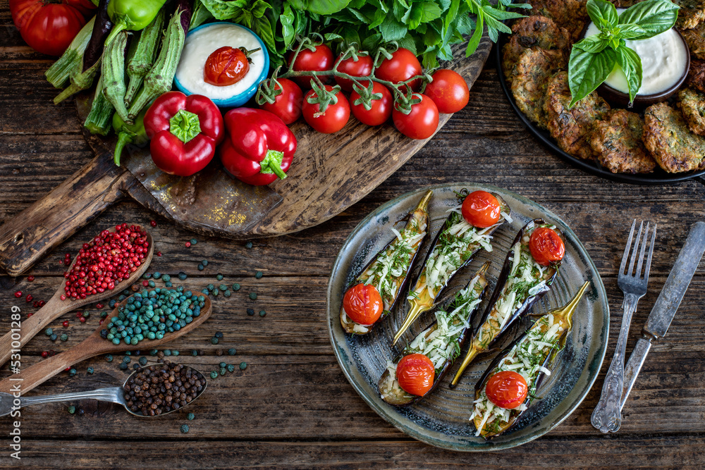 Grilled eggplants with tomato, parmesan cheese and dill. Grilled eggplants with tomato, parmesan cheese and dill.