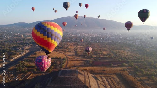 Sunrise on hot air balloon over the Teotihuacan pyramid photo
