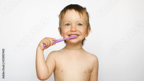 A cute boy has a fun brushing his teeth