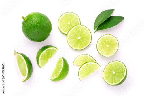 Lime with sliced and green leaf isolated on white background , top view , flat lay.