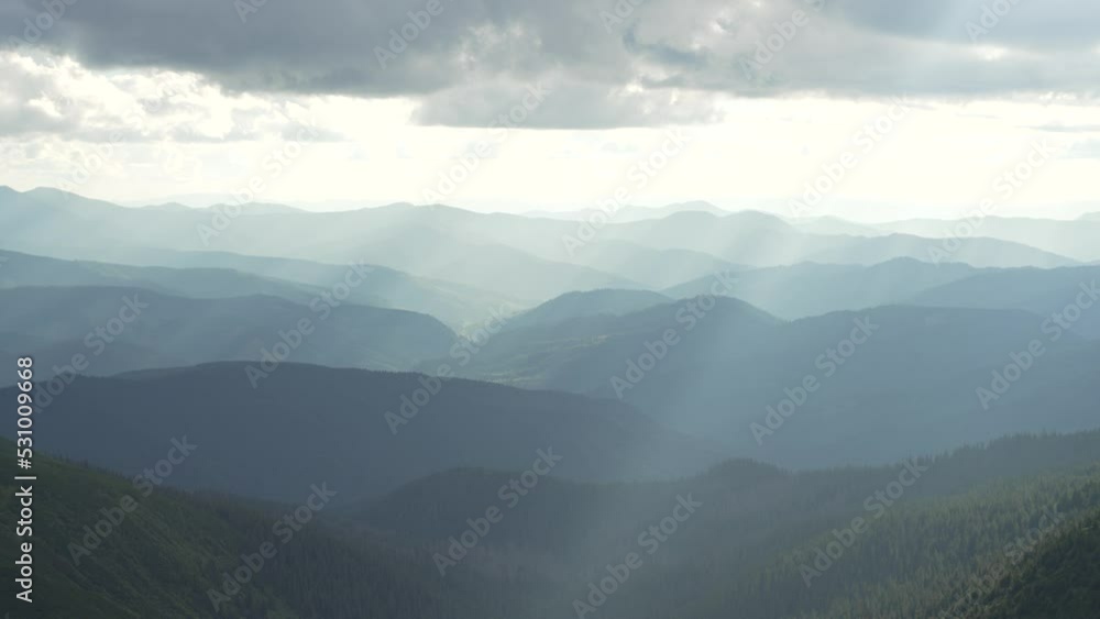 Mountains at sunset in a beautiful landscape. The mountain ranges are covered with fog. State of nature. High quality 4k footage Mountains at sunset in a beautiful landscape. The mountain ranges are covered with fog. State of nature. High quality 4k footage