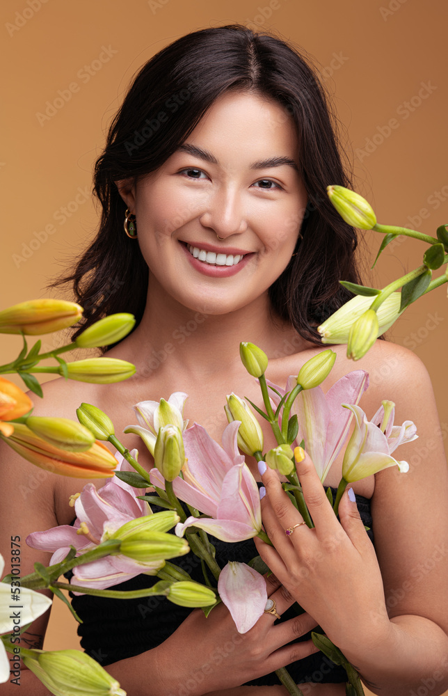 Optimistic Asian woman with fresh flowers - obrazy, fototapety, plakaty 