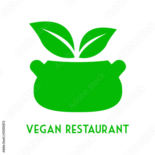 Concepto dieta vegana verde. Logo con texto Vegan Restaurant con silueta de cazuela y hojas de planta