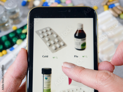 Wallpaper Mural hand scrolling through the site in medicines, buying medicines online on pills and stethoscope background,The concept of online pharmacy Torontodigital.ca