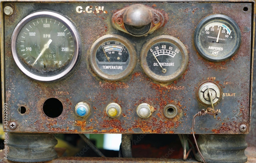 Close-up a vintage panel control dashboard of the old engine which have very rust.