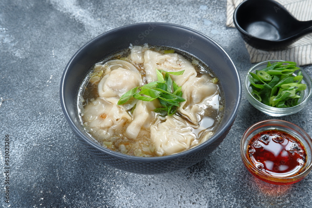 delicious of wonton soup with chili oil and green onion,chinese food,asian food style delicious of wonton soup with chili oil and green onion,chinese food,asian food style
