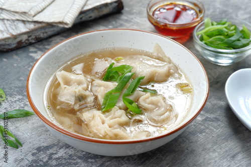 delicious of wonton soup with chili oil and green onion,chinese food,asian food style 